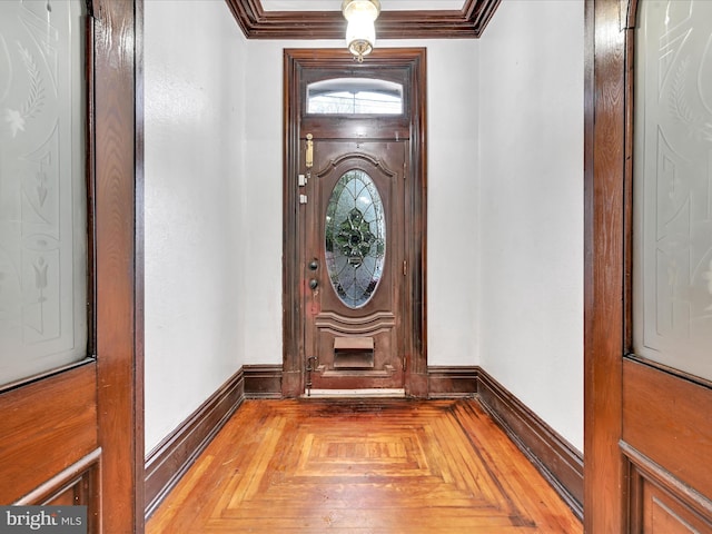 interior space featuring parquet floors and crown molding