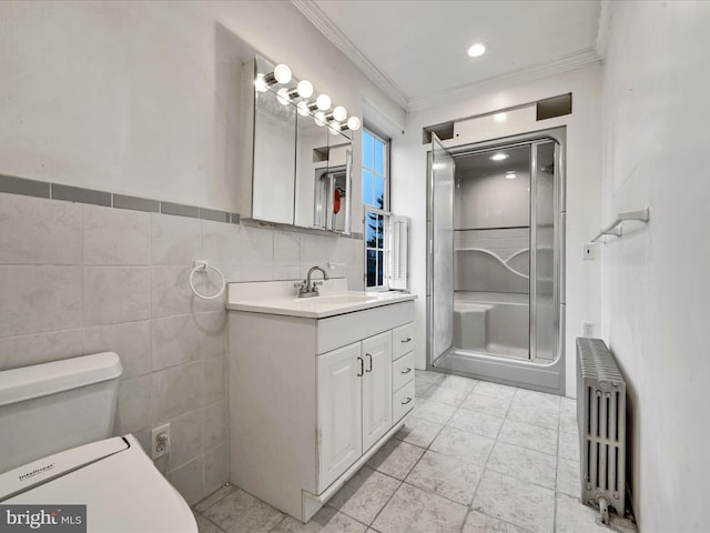 bathroom featuring vanity, crown molding, tile patterned flooring, tile walls, and radiator heating unit