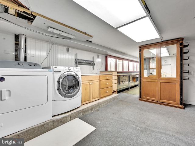 washroom with cabinets and independent washer and dryer