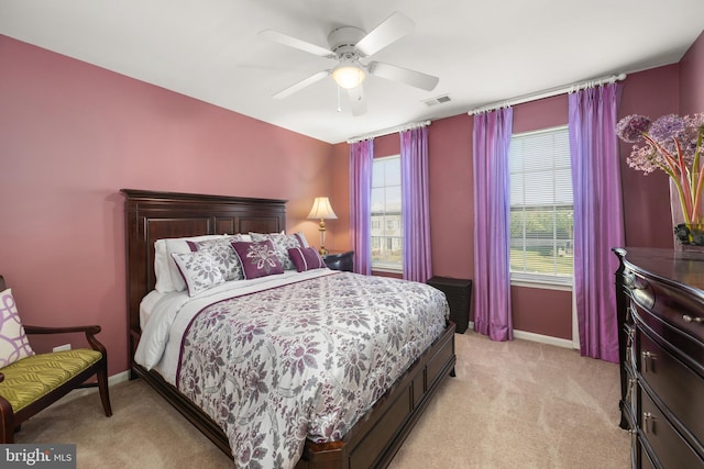 bedroom featuring ceiling fan and light colored carpet