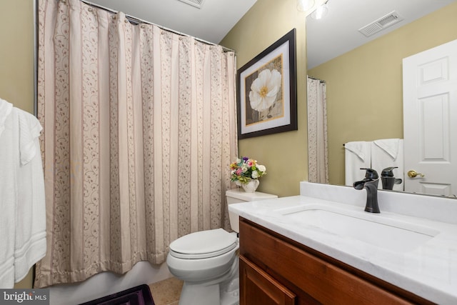 bathroom with tile patterned floors, vanity, and toilet