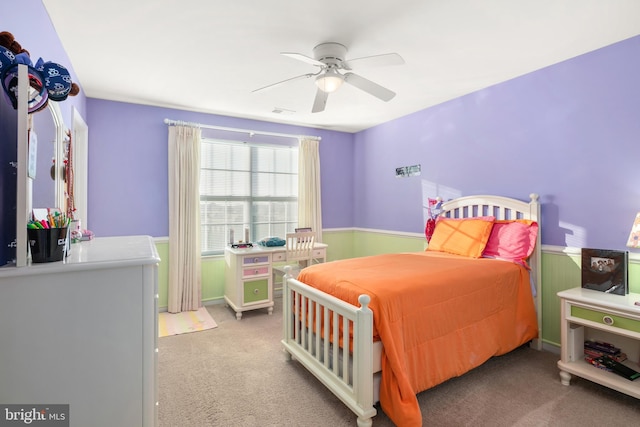 bedroom featuring light carpet and ceiling fan