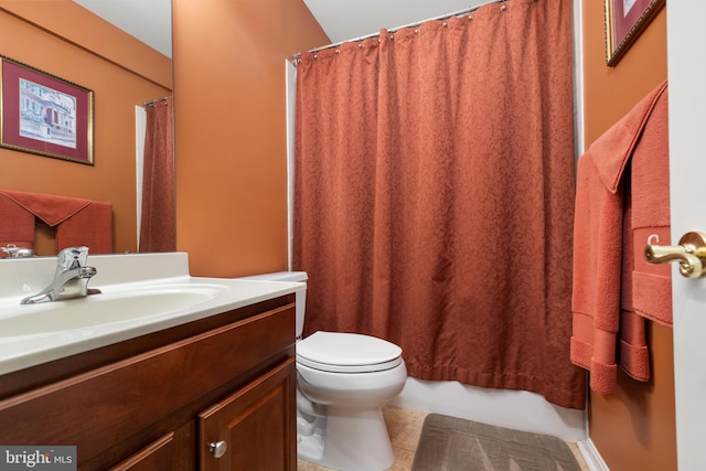 bathroom featuring tile patterned floors, vanity, and toilet