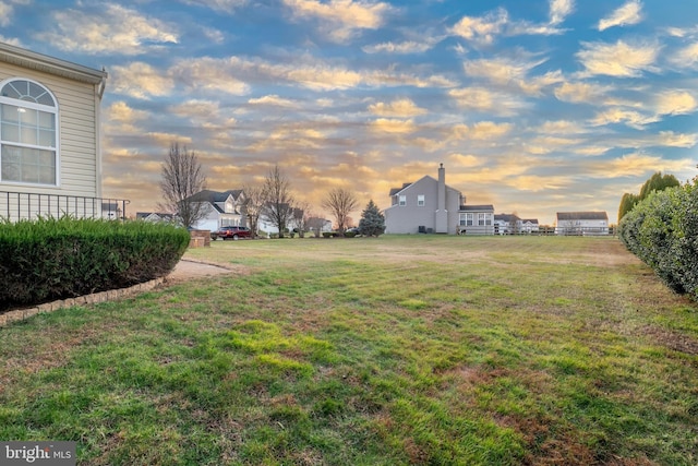 view of yard at dusk