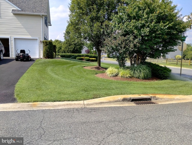 view of yard featuring a garage