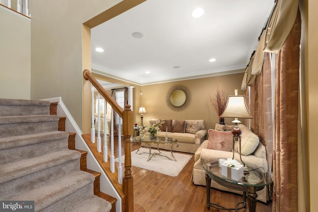 living room featuring hardwood / wood-style floors and ornamental molding