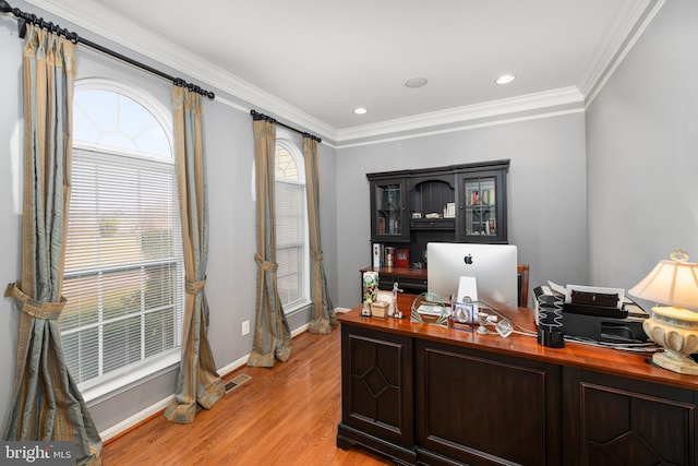 office featuring light hardwood / wood-style flooring and ornamental molding