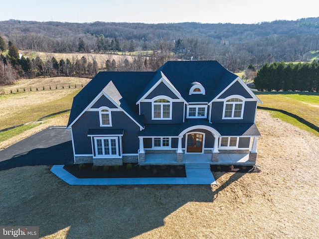 view of front of house featuring a front yard and french doors