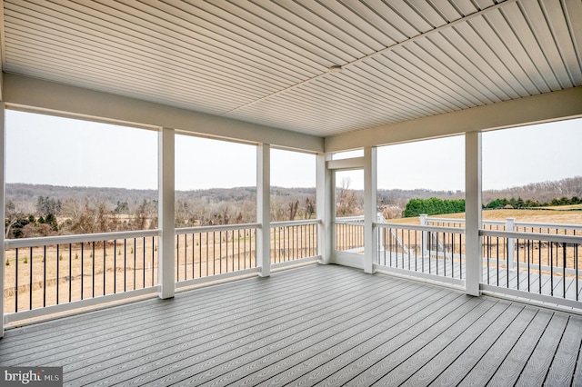 unfurnished sunroom featuring a healthy amount of sunlight