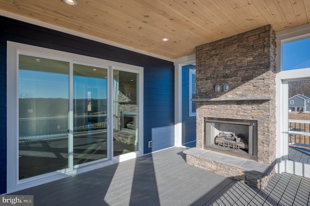 view of patio featuring an outdoor stone fireplace