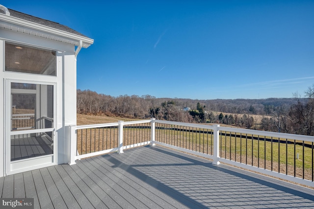 deck featuring a lawn