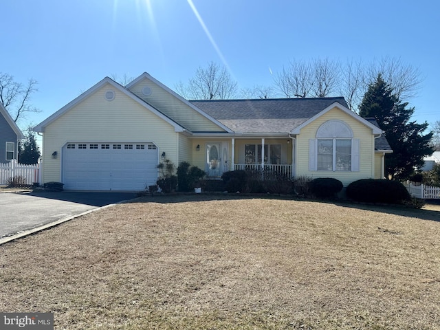 single story home featuring a garage and covered porch