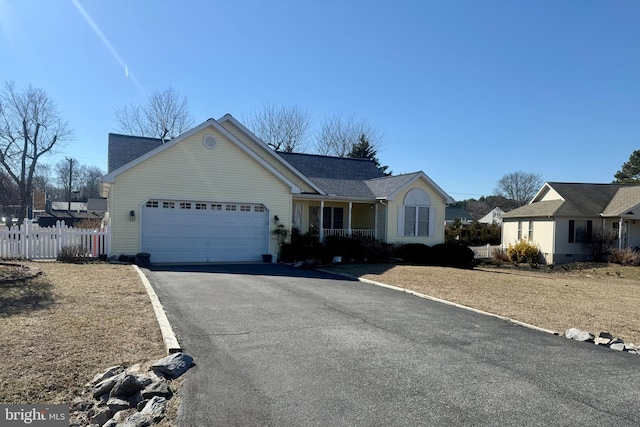 ranch-style home featuring a garage