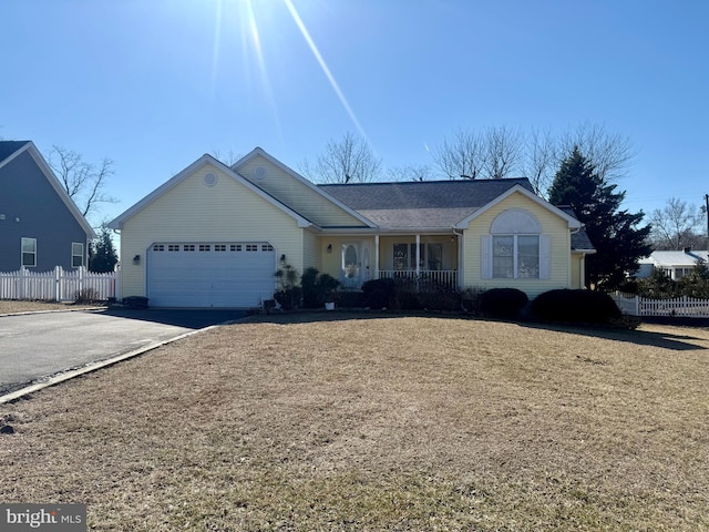 view of front of property featuring covered porch and a garage