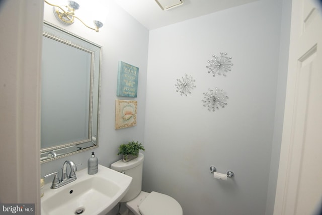 bathroom with toilet and sink