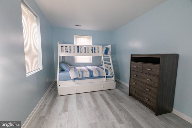 bedroom with light wood-type flooring