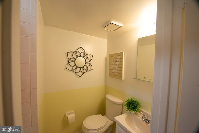 bathroom with vanity and toilet