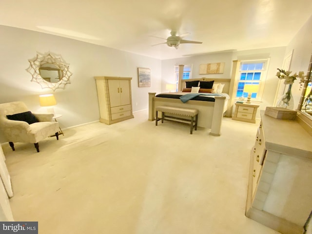 interior space featuring ceiling fan and light colored carpet