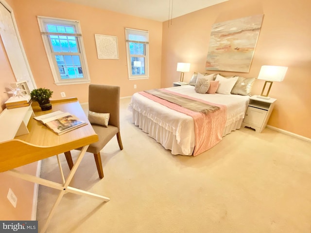 bedroom with carpet flooring and multiple windows