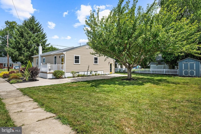 exterior space with covered porch and a storage shed