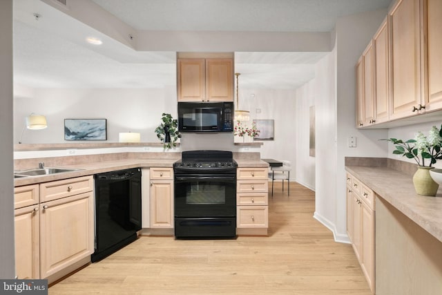 kitchen with black appliances, sink, light hardwood / wood-style flooring, light brown cabinetry, and kitchen peninsula