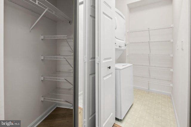 laundry room featuring stacked washing maching and dryer