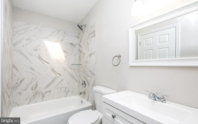 full bathroom featuring vanity, tiled shower / bath combo, and toilet