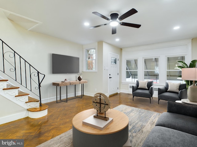 living room featuring dark parquet floors and ceiling fan