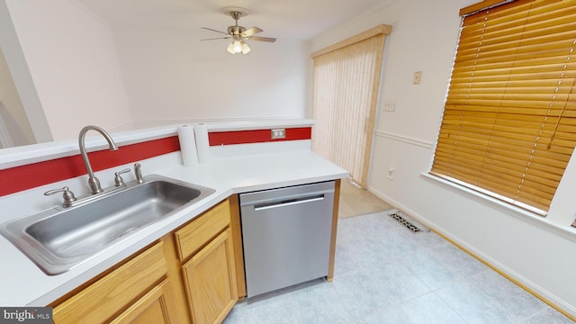 kitchen with stainless steel dishwasher, ceiling fan, sink, and light brown cabinetry