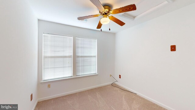 carpeted empty room with ceiling fan