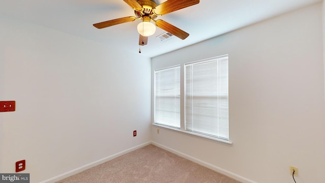 unfurnished room with ceiling fan and light colored carpet