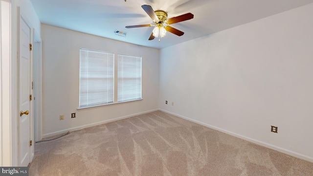 carpeted empty room with ceiling fan