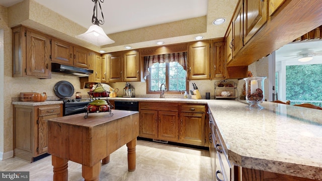 kitchen with sink, ceiling fan, hanging light fixtures, a center island, and range with electric stovetop