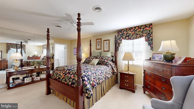 bedroom with light colored carpet and ceiling fan