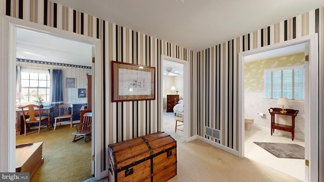 sitting room with light colored carpet