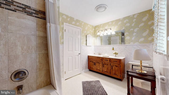 bathroom featuring shower / tub combo with curtain and vanity