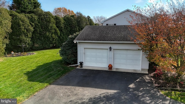 garage with a lawn