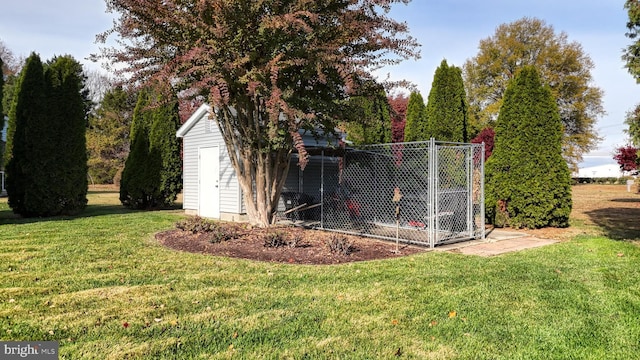 view of outdoor structure featuring a lawn