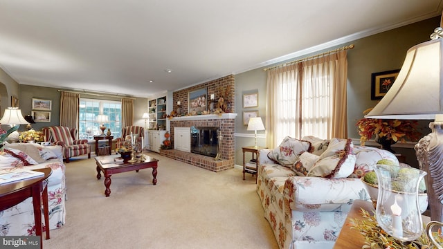 living room featuring light carpet, a brick fireplace, crown molding, and built in features