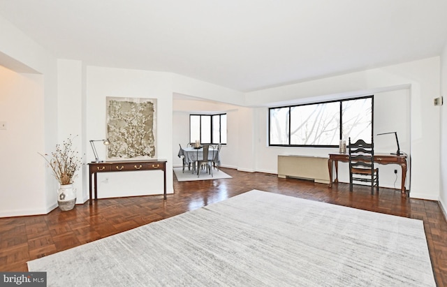 living area with dark parquet floors