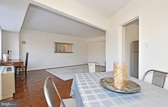 dining room featuring dark parquet floors