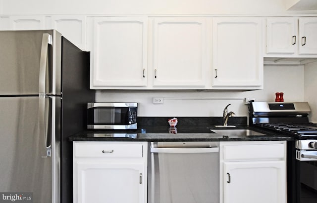 kitchen with sink, white cabinetry, and appliances with stainless steel finishes