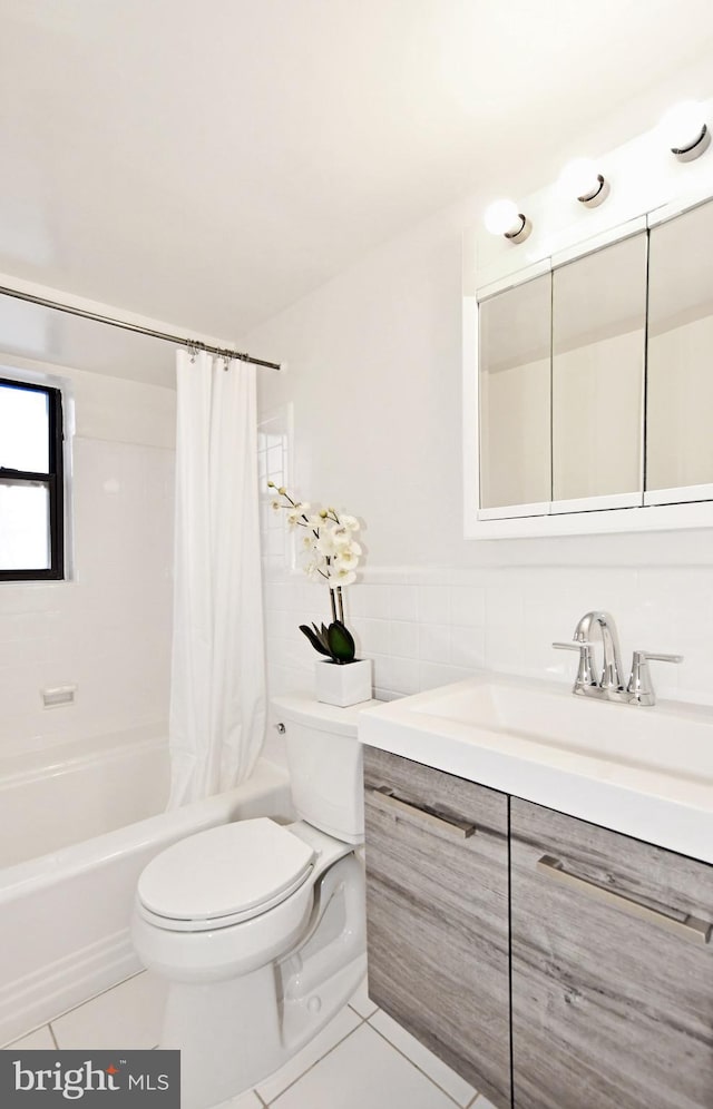 full bathroom with vanity, toilet, tile patterned floors, and shower / bath combo