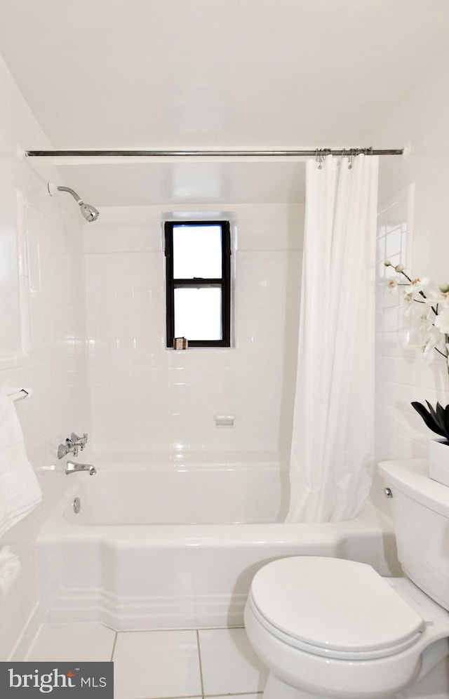 bathroom featuring tile patterned floors and toilet