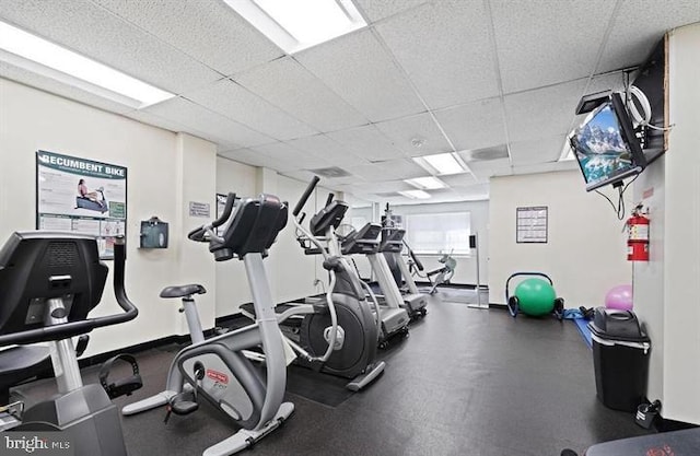 exercise room featuring a drop ceiling