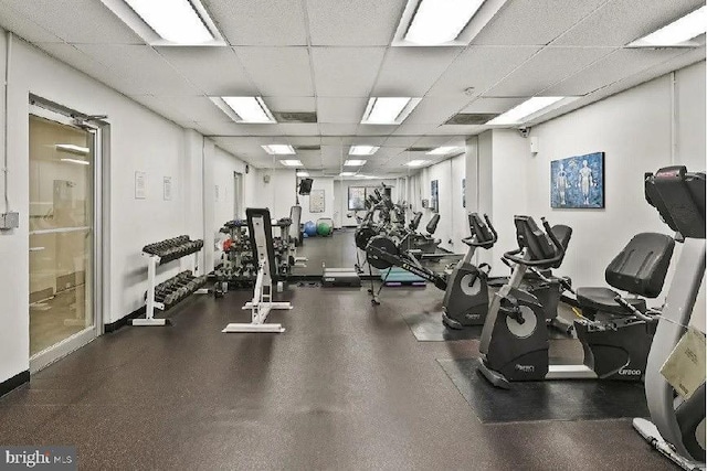 exercise room with a drop ceiling