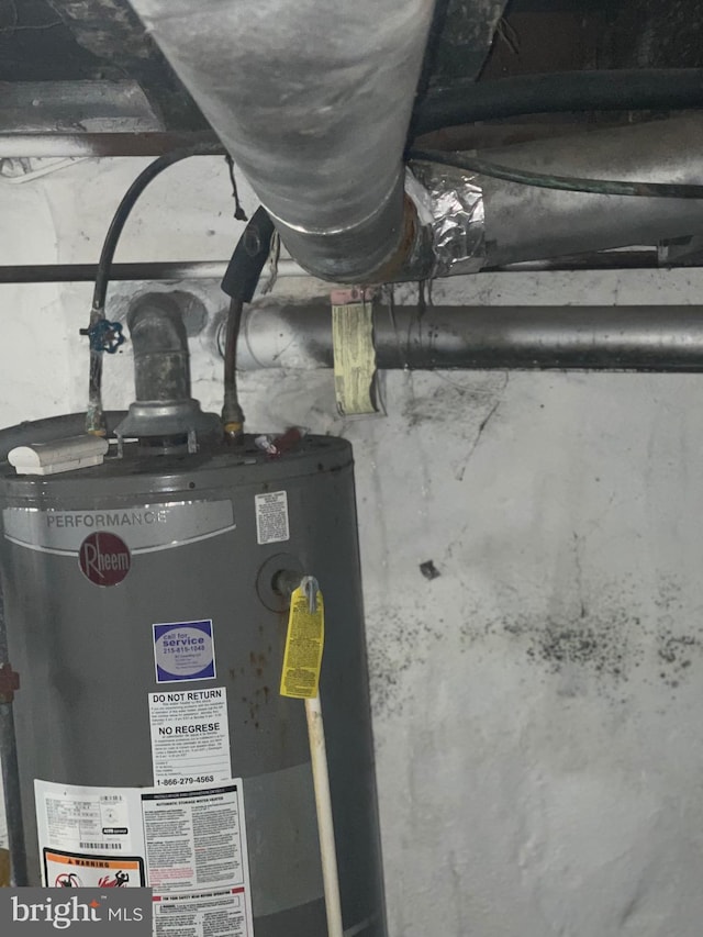 utility room featuring gas water heater