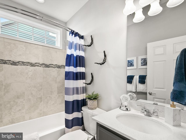 full bathroom with vanity, toilet, and shower / bath combo with shower curtain