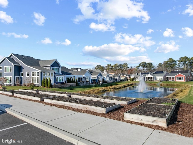 surrounding community featuring a water view