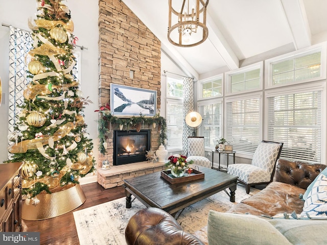 living room featuring beam ceiling, an inviting chandelier, high vaulted ceiling, hardwood / wood-style floors, and a fireplace